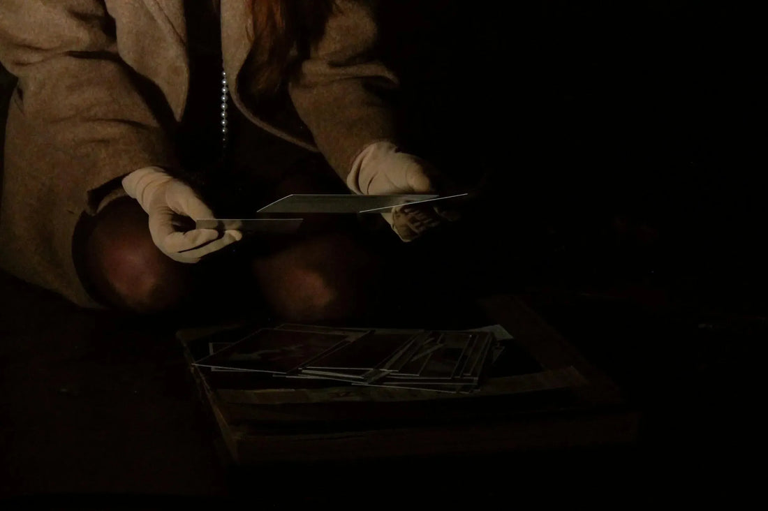 Inspecting a flat cap with raking light for stains, thinning and fraying