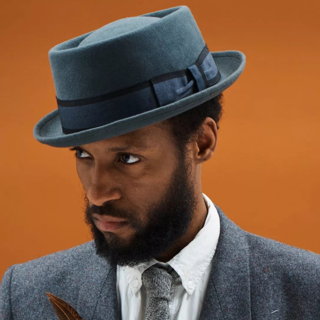 Orange pork pie hat hotsell